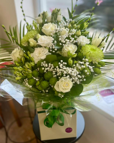 Evelyn - A fabulous collection of white and cream flowers make this the perfect gift. This bouquet will be hand delivered by the local florist.