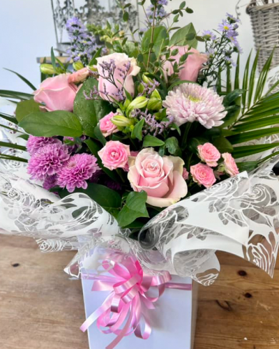 Ashleigh - A budding delight, complimented by greenery and presented in a gift box/bag. Beautiful flower bouquet hand delivered by the local florist.