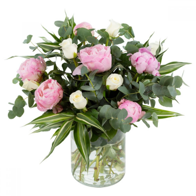 Pink Clouds - This dreamy vase arrangement promises to make a lasting impression! Comprised with only the finest peonies along with an entourage of roses. Delivered in a pink and white colourway with complimentary foliage.
