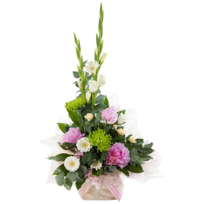 High Rise - This stunning arrangement is sure to inspire flower lovers everywhere. Featuring bold and beautiful peonies along with a harmonious selection of complementary flowers.